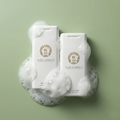 Two bottles of 'Rare Elements' on a green background