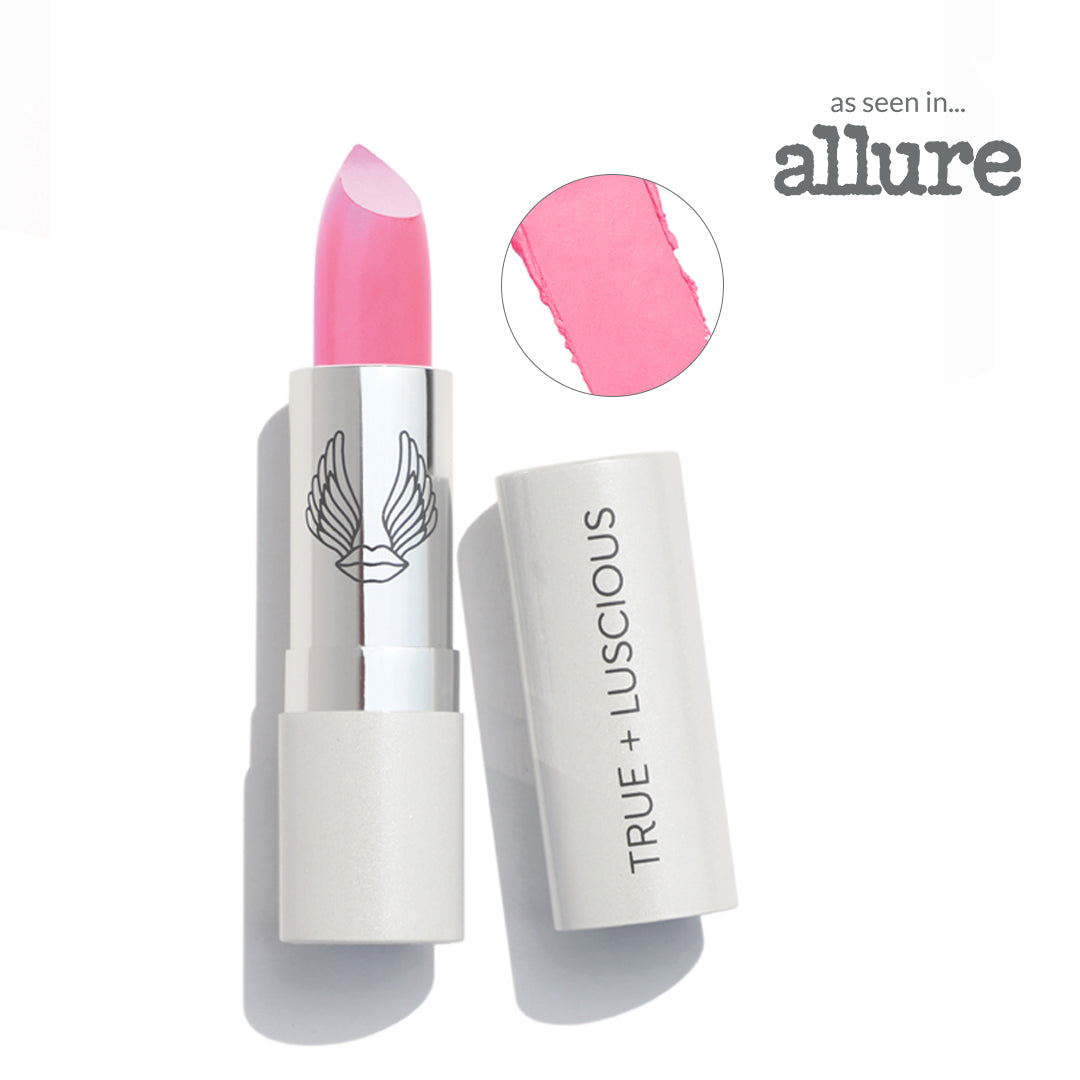Pink lipstick with white casing on a white background, featuring the 'True + Luscious' brand.