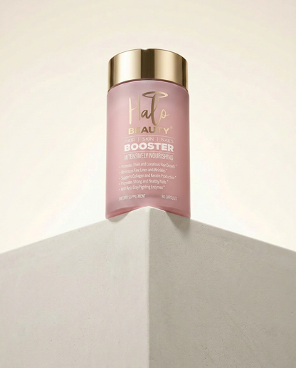 Hair booster supplement container on a neutral background