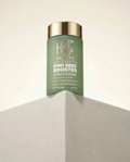 Green bottle of 'Hilo Beauty' Kiwi Seed Booster on a neutral background