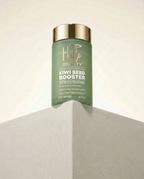 Green bottle of 'Hilo Beauty' Kiwi Seed Booster on a neutral background