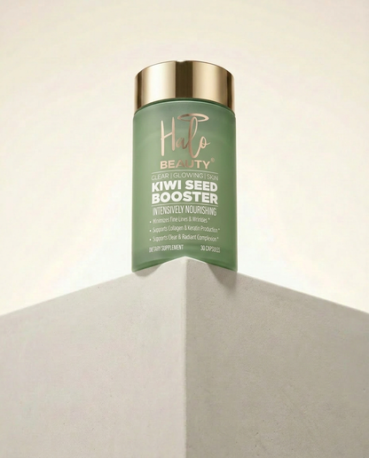 Green bottle of 'Hilo Beauty' Kiwi Seed Booster on a neutral background