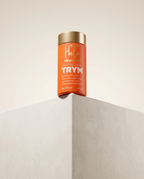 Hair product canister labeled 'TRYM' on a neutral background