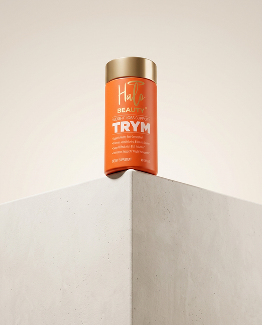 Hair product canister labeled 'TRYM' on a neutral background